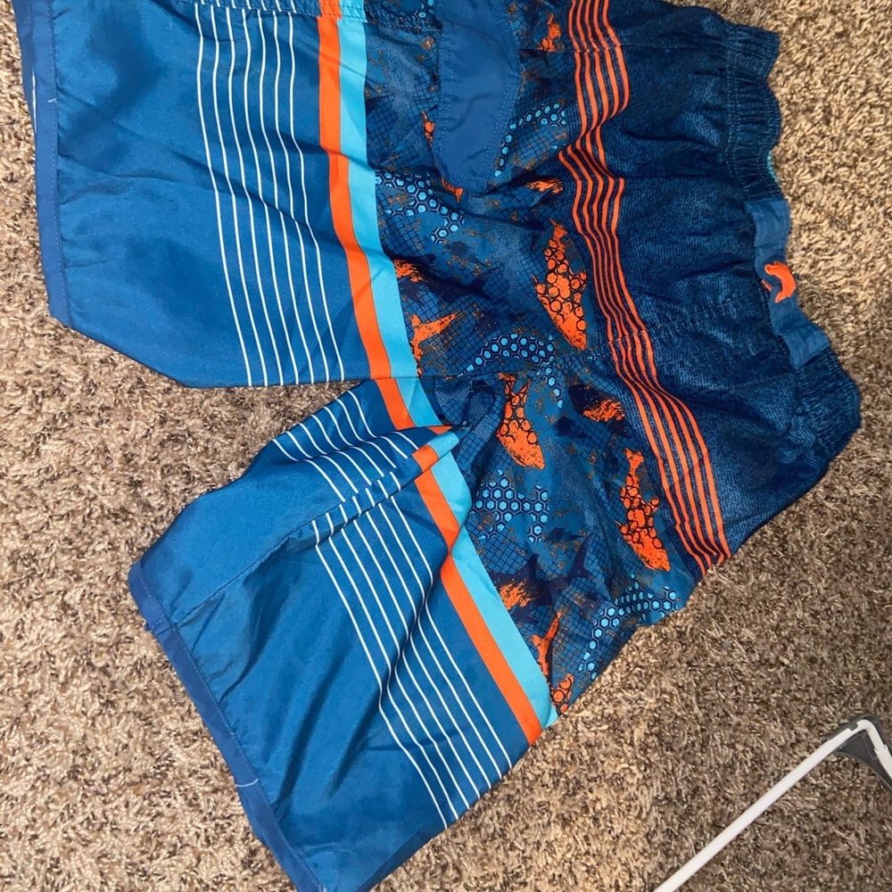 Orange and blue swim trunks